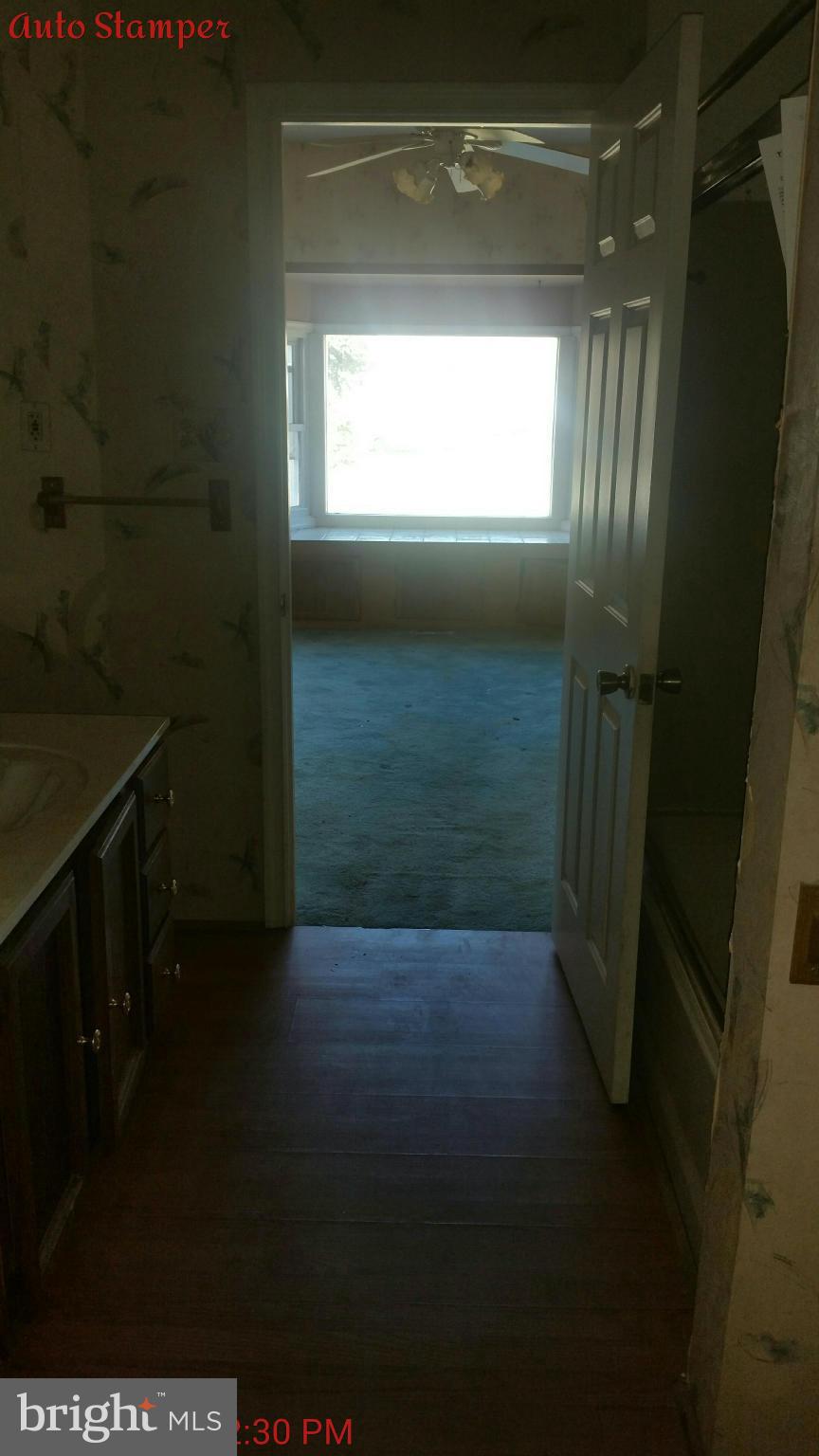 8611 Inwood Road Baltimore, MD 21244 - Photo 6 of 23 a view of hallway with window