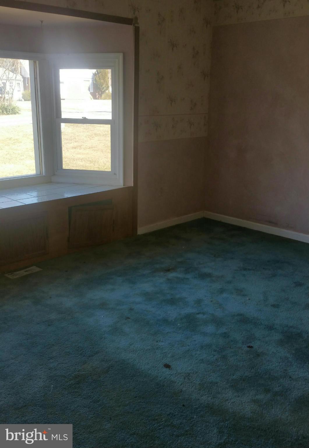 8611 Inwood Road Baltimore, MD 21244 - Photo 7 of 23 a view of an empty room with a window
