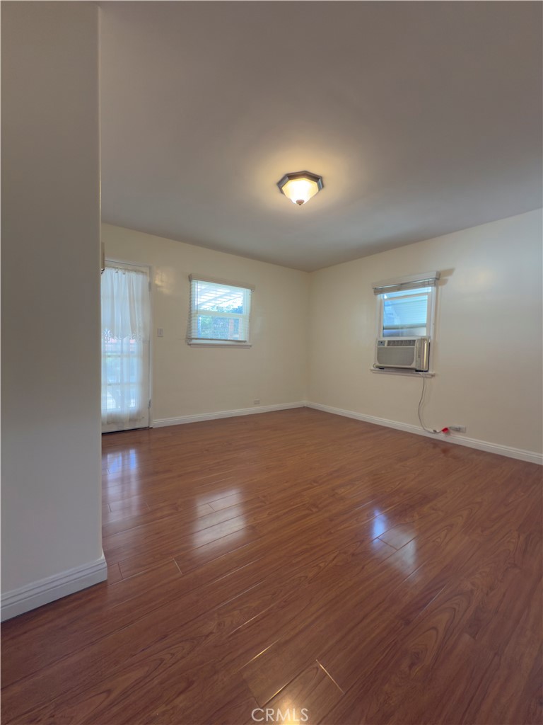 3204 Hempstead Avenue Arcadia, CA 91006 - Photo 12 of 16 an empty room with wooden floor and windows