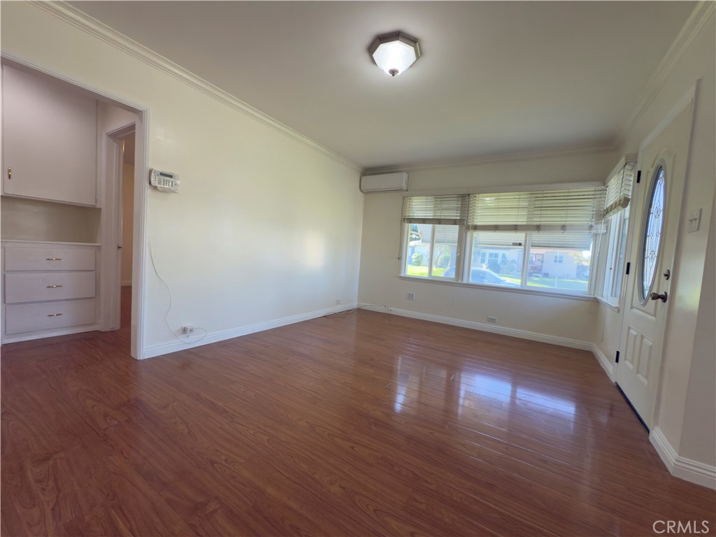 3204 Hempstead Avenue Arcadia, CA 91006 - Photo 5 of 16 an empty room with wooden floor and windows