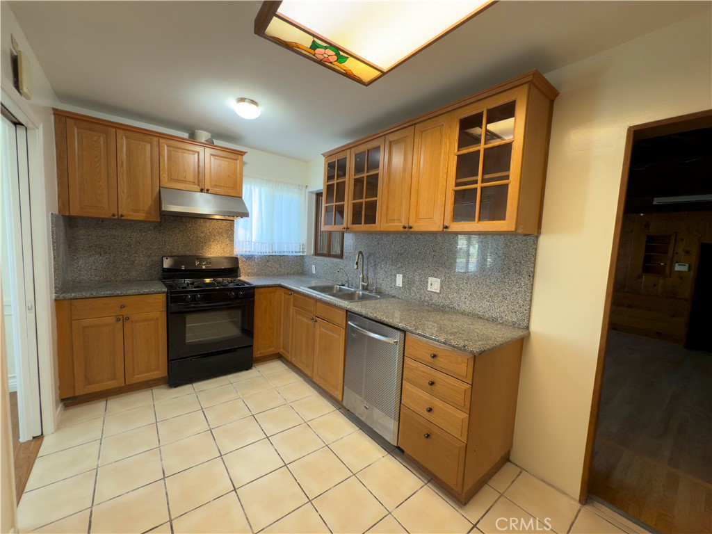 3204 Hempstead Avenue Arcadia, CA 91006 - Photo 9 of 16 a kitchen with stainless steel appliances granite countertop a stove a sink and a refrigerator