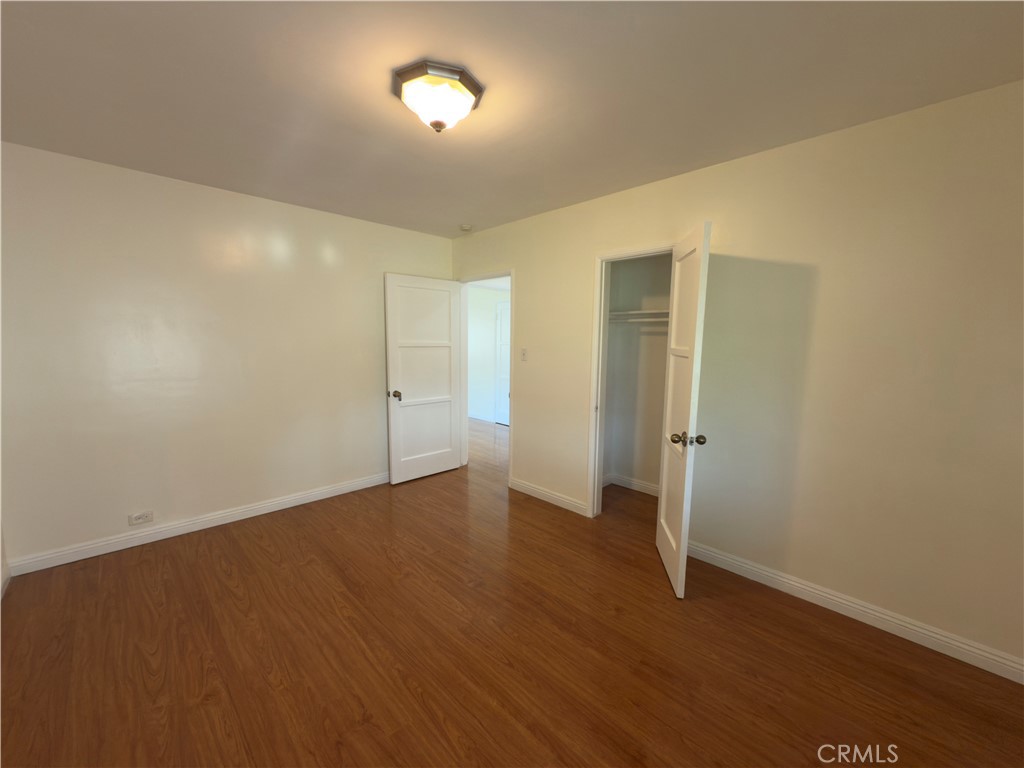 3204 Hempstead Avenue Arcadia, CA 91006 - Photo 10 of 16 an empty room with wooden floor and closet