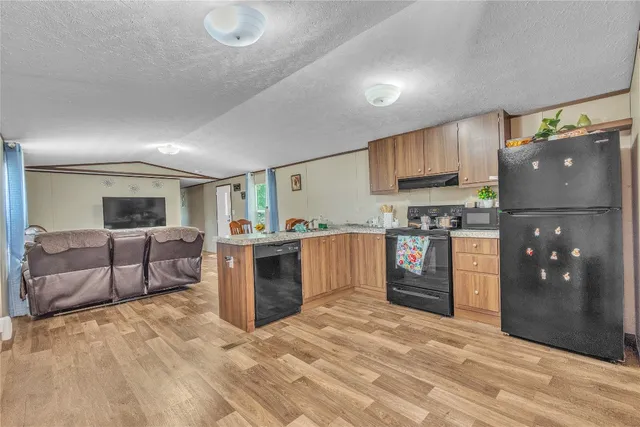 a bedroom with a bed and lamps