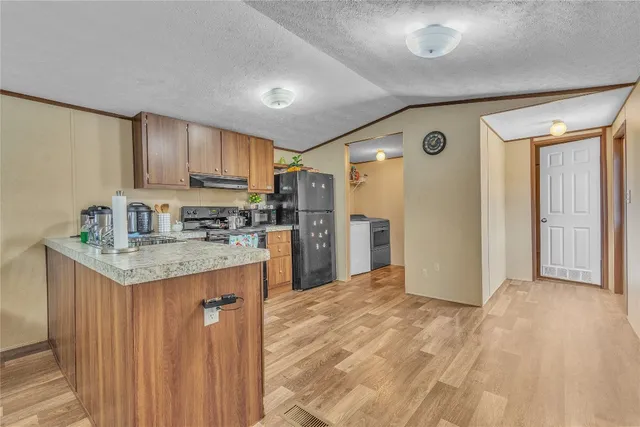 a bedroom with a bed and a table