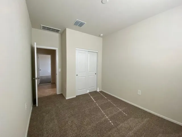 a view of a lake with beach and island in front of it
