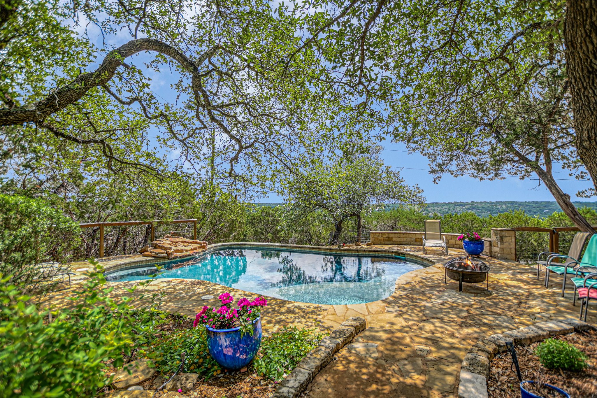 590 Rancho Grande Drive Wimberley, TX 78676 - Photo 2 of 30 a view of a swimming pool with a patio