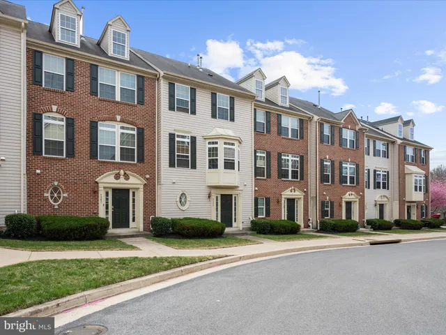 a front view of a building with a yard