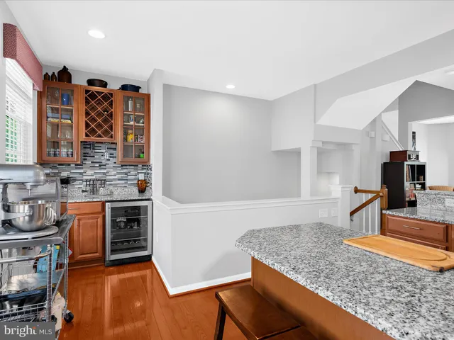 a kitchen with stainless steel appliances granite countertop a stove and a sink