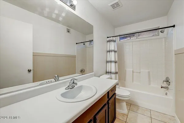 a bathroom with a sink toilet tub and shower