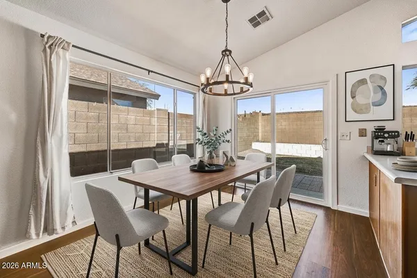 a view of a dining room with furniture window and wooden floor