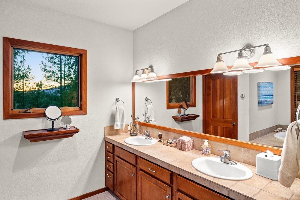 238 Clouds Rest Portola, CA 96122 - Photo 17 of 34 a bathroom with a sink double vanity and a mirror
