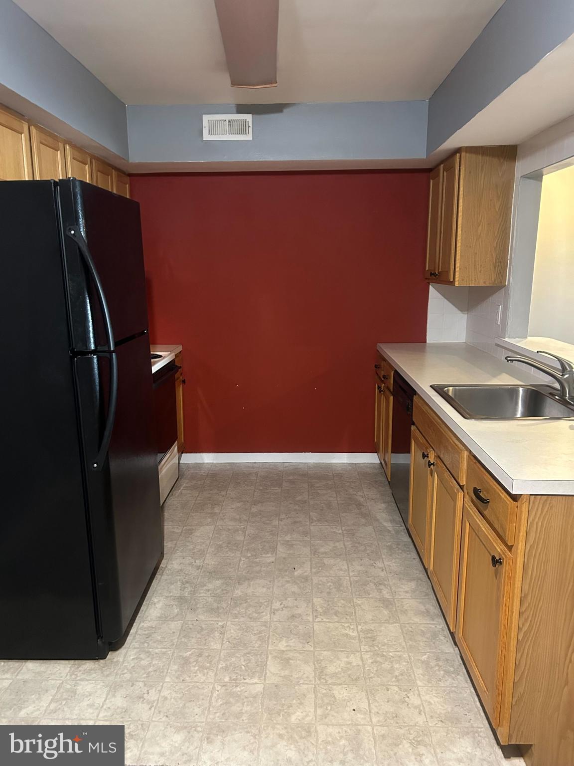 413 Gregorys Way Voorhees, NJ 08043 - Photo 3 of 11 a kitchen with stainless steel appliances a refrigerator and a sink