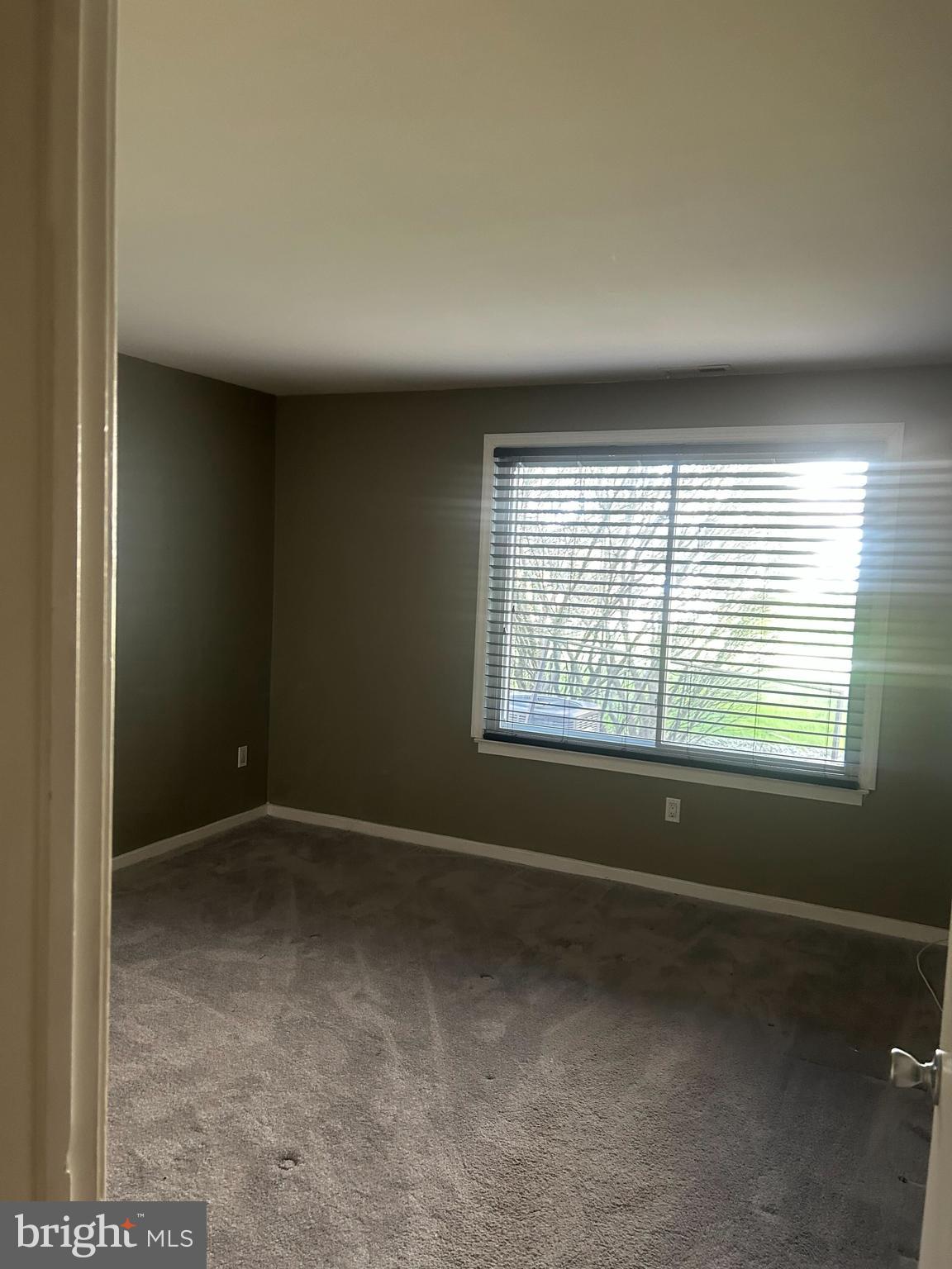 413 Gregorys Way Voorhees, NJ 08043 - Photo 6 of 11 an empty room with a window