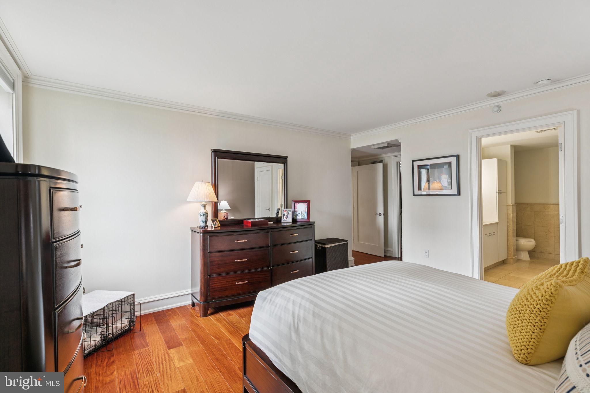 219 South 18th Street, Unit 1506 Philadelphia, PA 19103 - Photo 12 of 28 a bedroom with a bed and a dresser