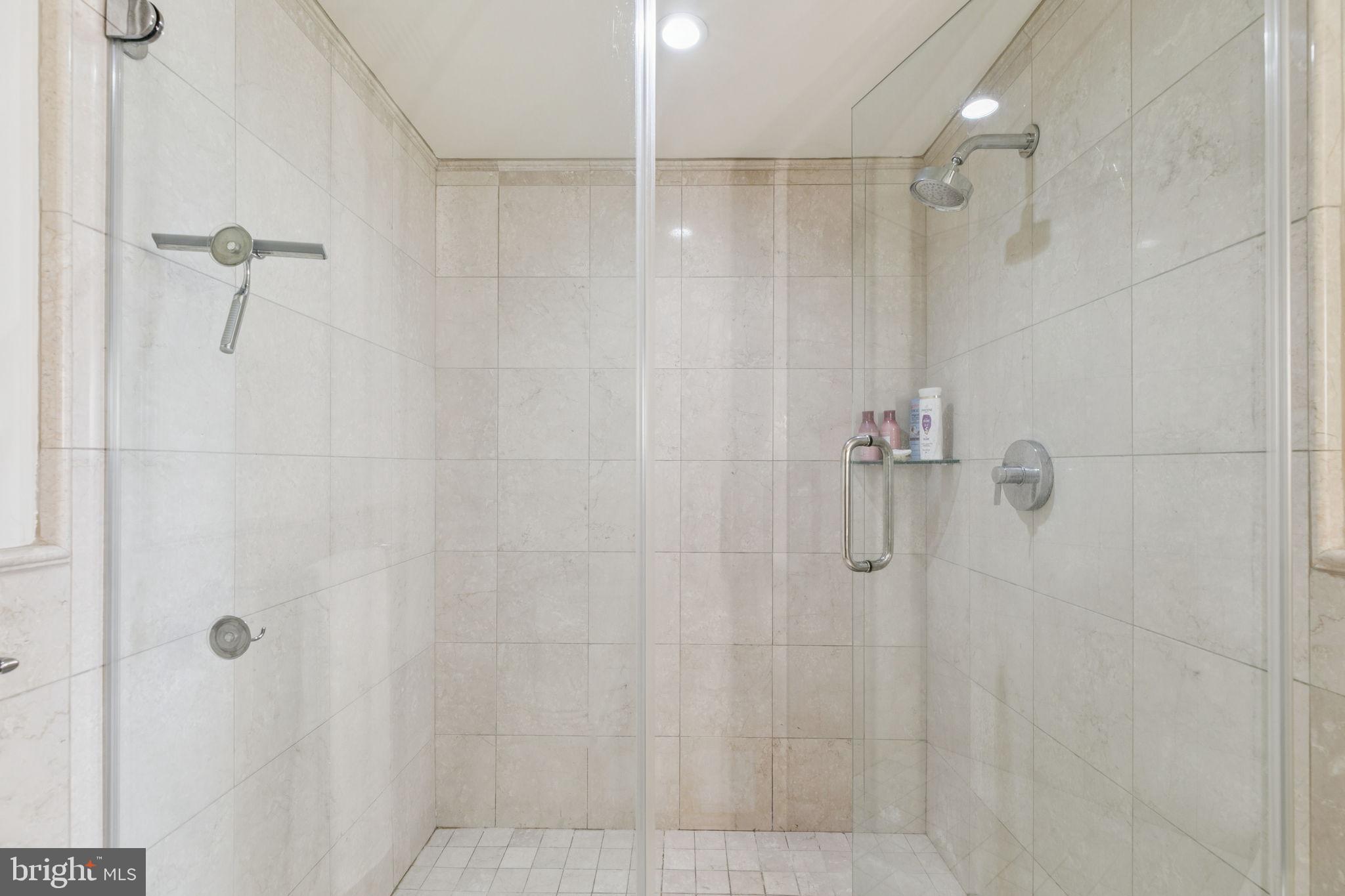 219 South 18th Street, Unit 1506 Philadelphia, PA 19103 - Photo 14 of 28 a bathroom with a shower