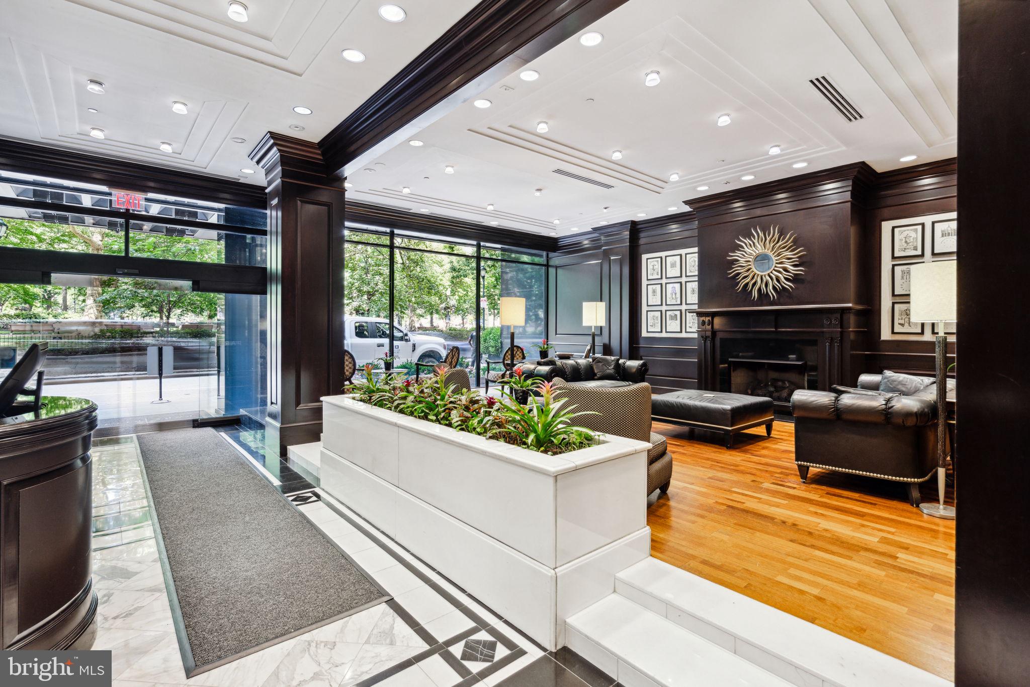 219 South 18th Street, Unit 1506 Philadelphia, PA 19103 - Photo 26 of 28 a living room with fireplace furniture and a large window