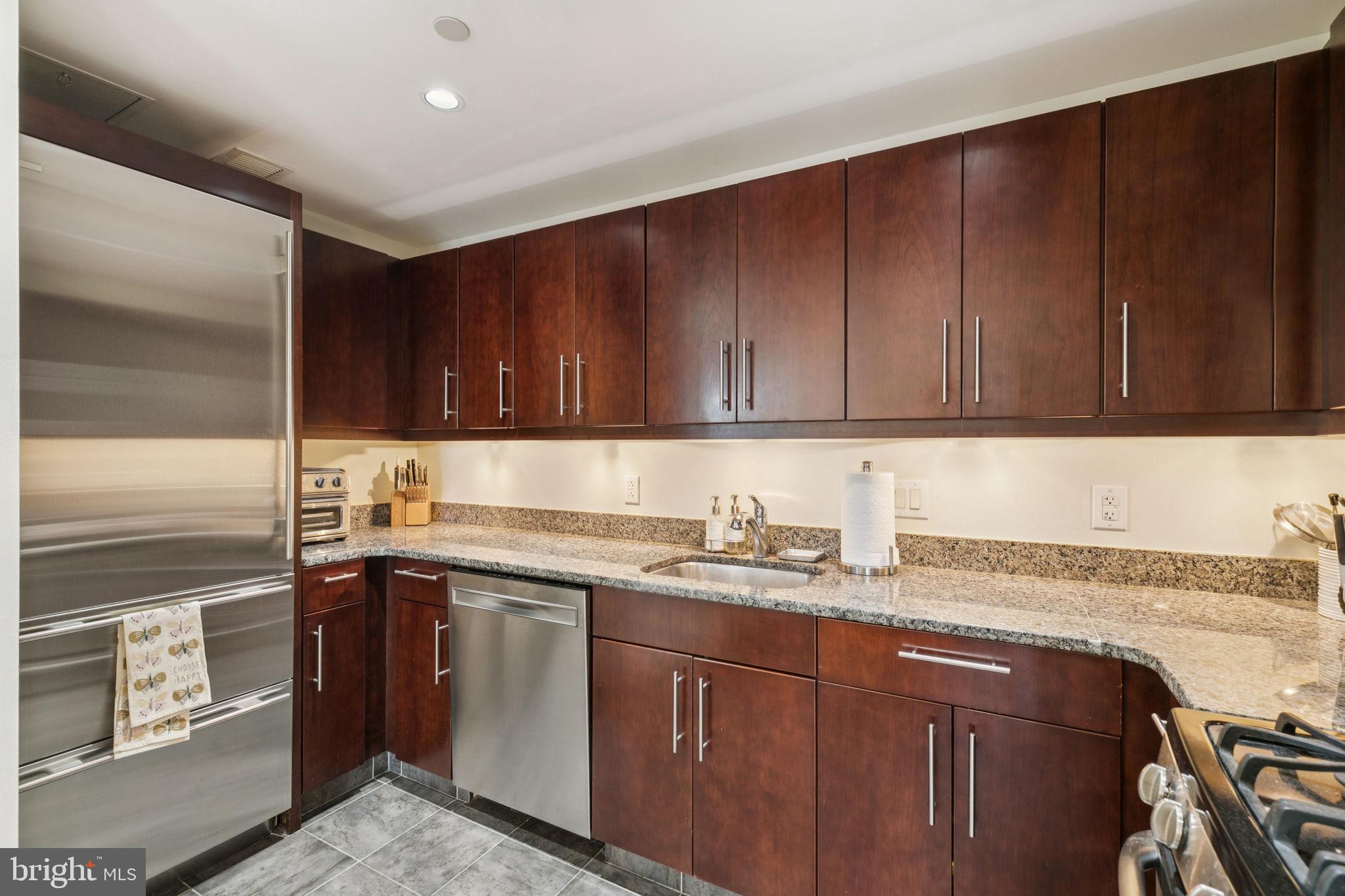 219 South 18th Street, Unit 1506 Philadelphia, PA 19103 - Photo 10 of 28 a kitchen with a sink and cabinets