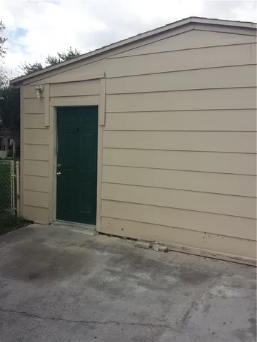 an empty room with a wooden door