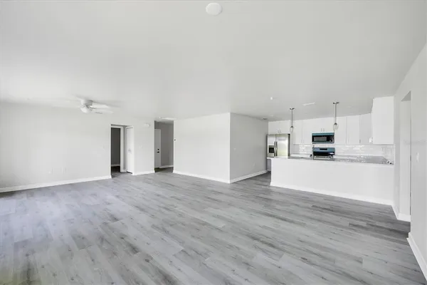 a kitchen with a sink stove and microwave