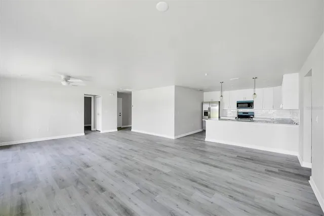 a kitchen with a sink stove and microwave