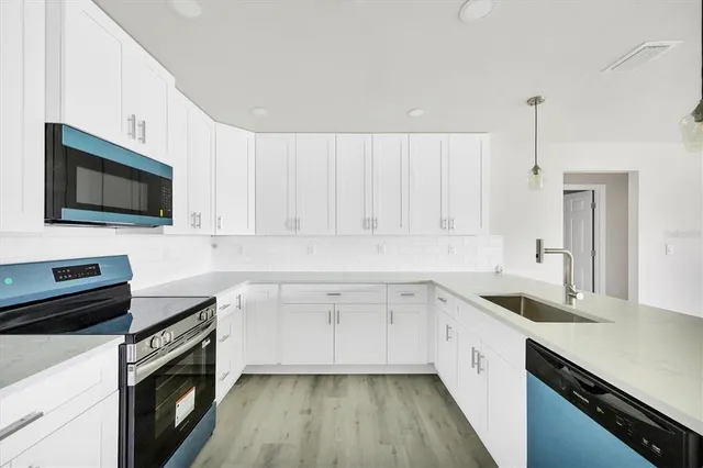 a bathroom with 2 sink and a mirror