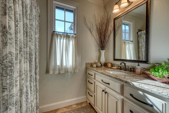 a view of a porch with a floor to ceiling window next to a yard