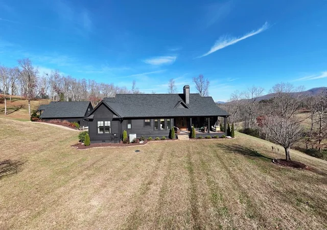 a view of a lake with a yard