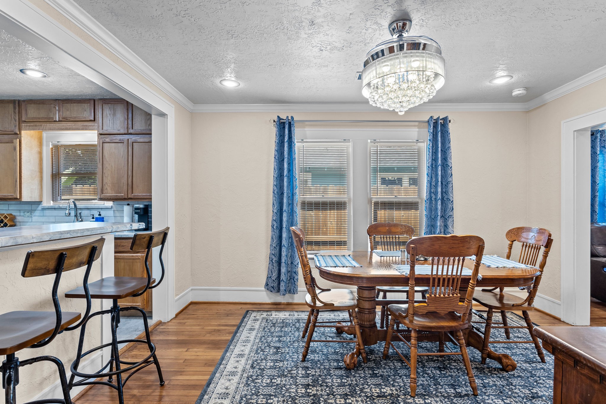 1526 Lawson Street Houston, TX 77023 - Photo 13 of 25 a dining room with furniture a chandelier and wooden floor
