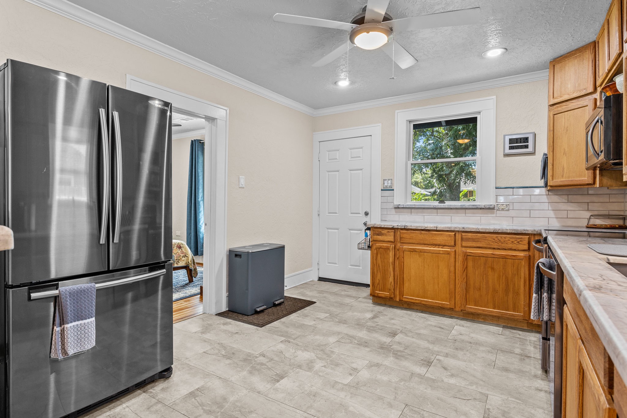 1526 Lawson Street Houston, TX 77023 - Photo 16 of 25 a kitchen with stainless steel appliances granite countertop a refrigerator a sink a stove top oven and a refrigerator