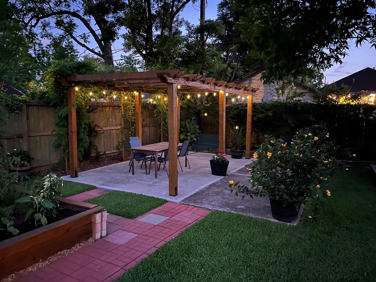 1526 Lawson Street Houston, TX 77023 - Photo 25 of 25 a view of a patio with table and chairs potted plants and large tree