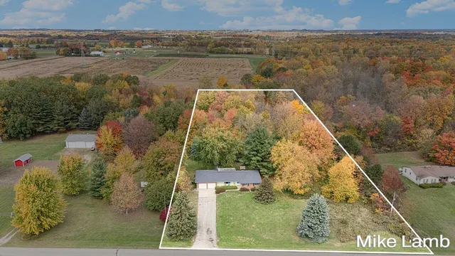 $405,000 | 3825 14 Mile Road Northwest, Sparta, MI 49345