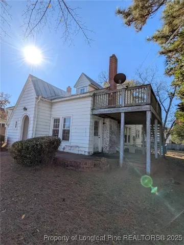 a front view of a house with plants