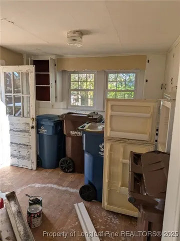 a kitchen with a cabinets and appliances