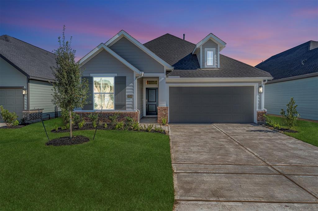 16002 Copper Skies Way Cypress, TX 77429 - Photo 1 of 46 a front view of a house with a yard and garage