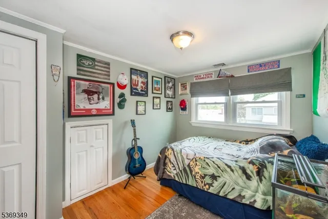 a bedroom with bed and a window