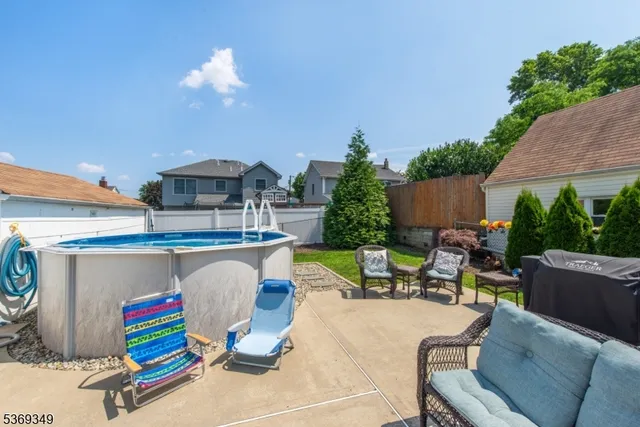 a view of backyard with outdoor seating and kitchen view
