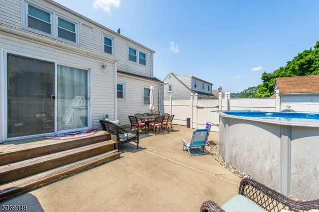 a wooden bench sitting in front of a building