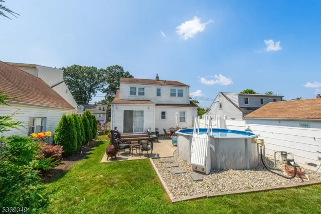 a view of a house with a yard porch and sitting area