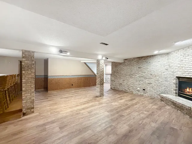 a bathroom with a sink toilet and mirror