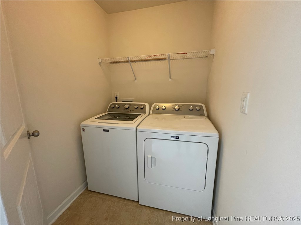 1023 Saffron Loop Durham, NC 27713 - Photo 11 of 18 a utility room with dryer and washer