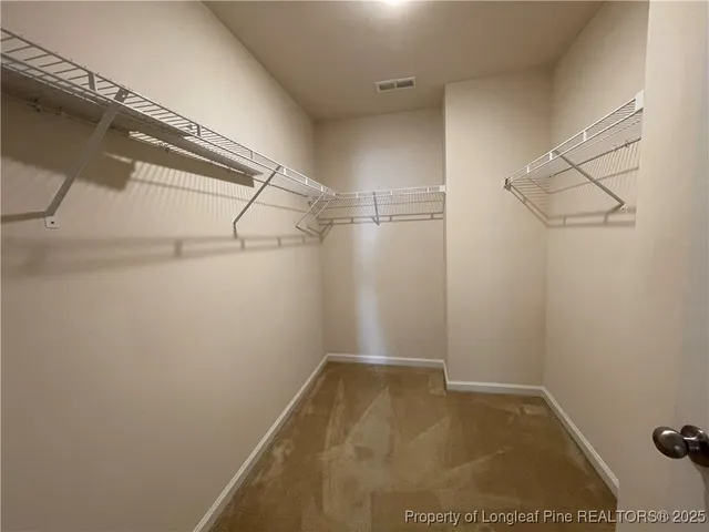 a view of a room with racks on the wall