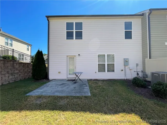 a view of a back yard of the house