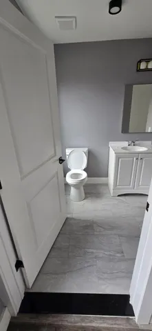 a bathroom with a toilet and a sink