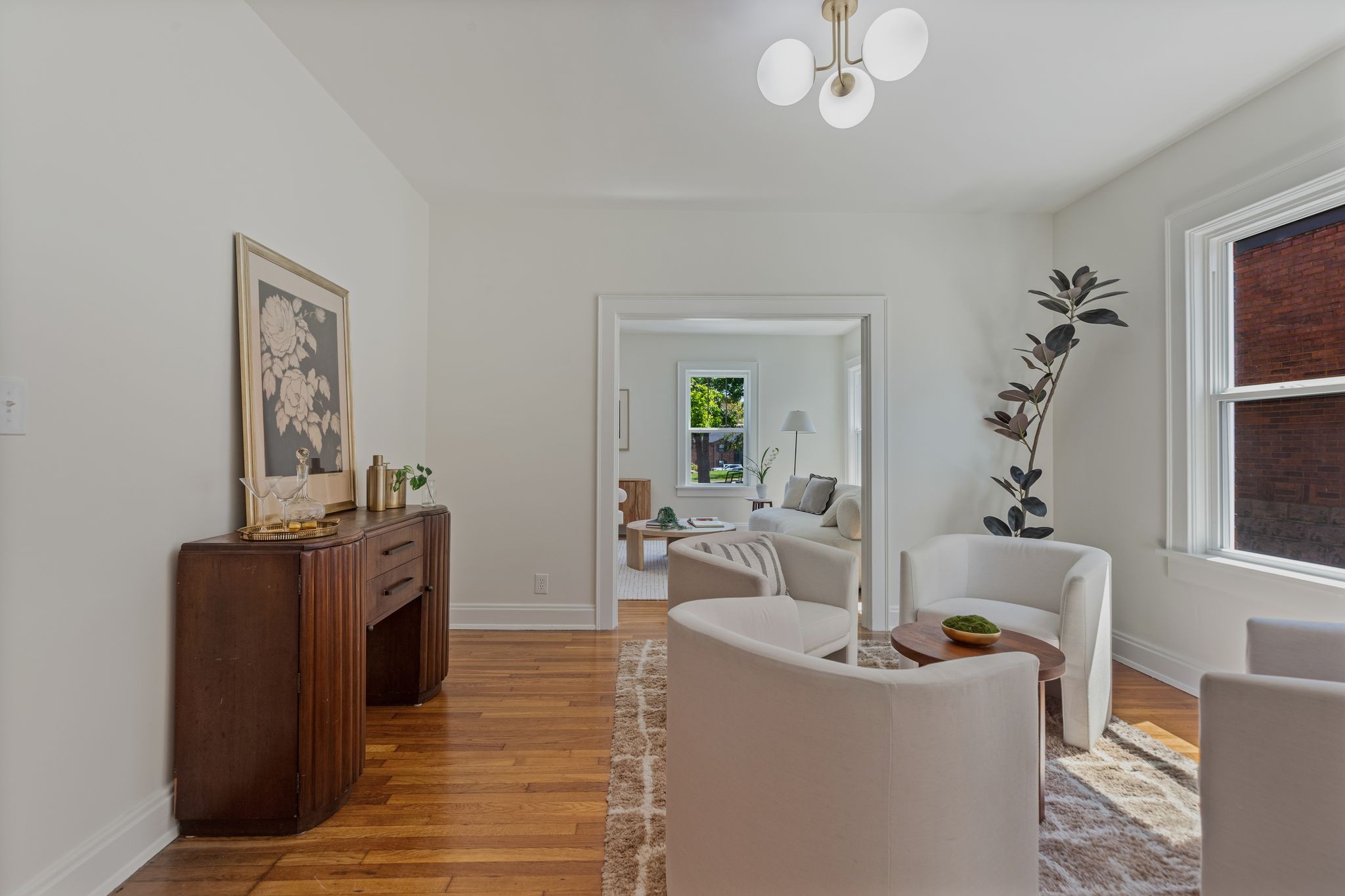 2005 Convent Place, Unit 1 Nashville, TN 37212 - Photo 17 of 41 a living room with furniture and a chandelier