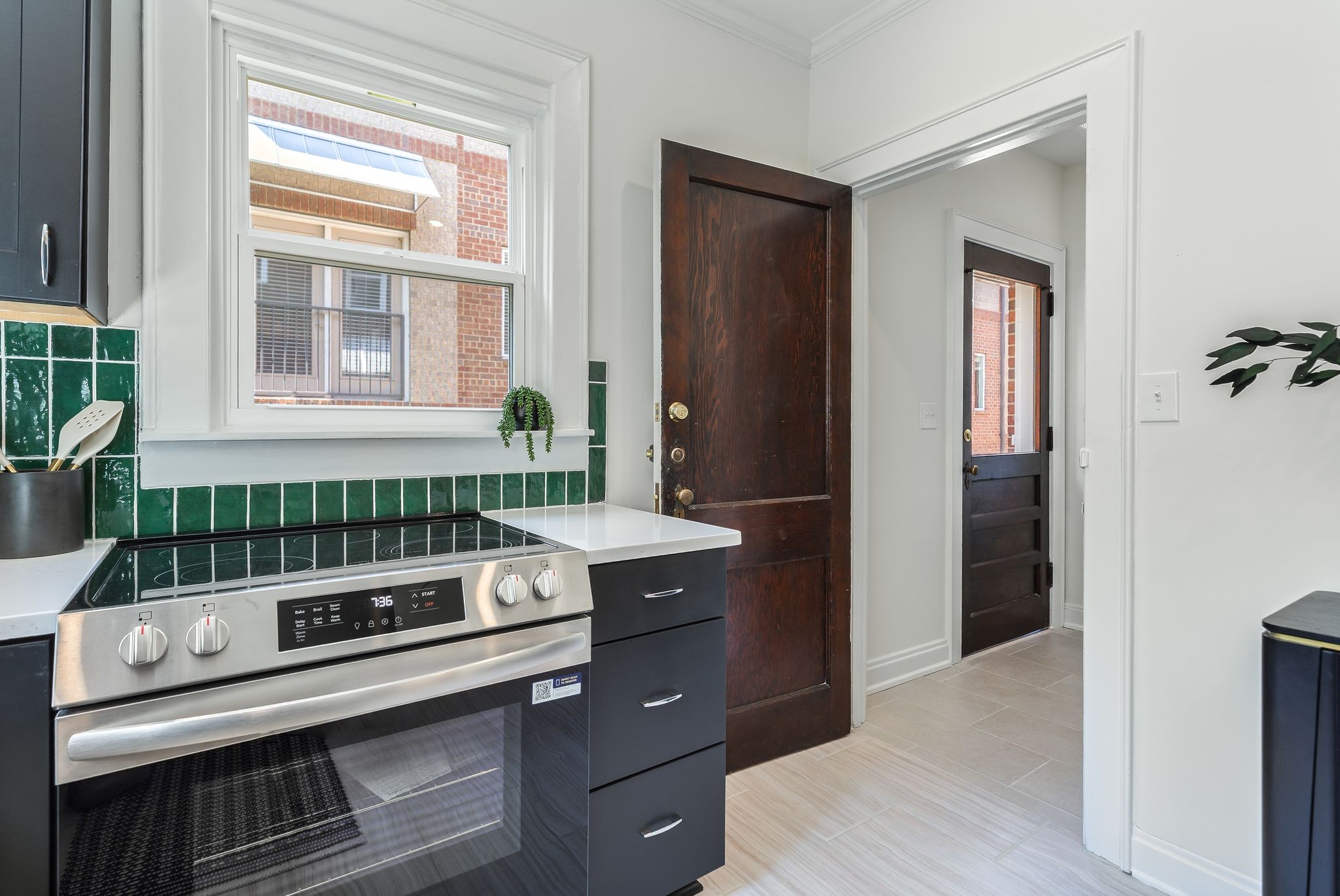 2005 Convent Place, Unit 1 Nashville, TN 37212 - Photo 32 of 41 a kitchen with a stove and a sink