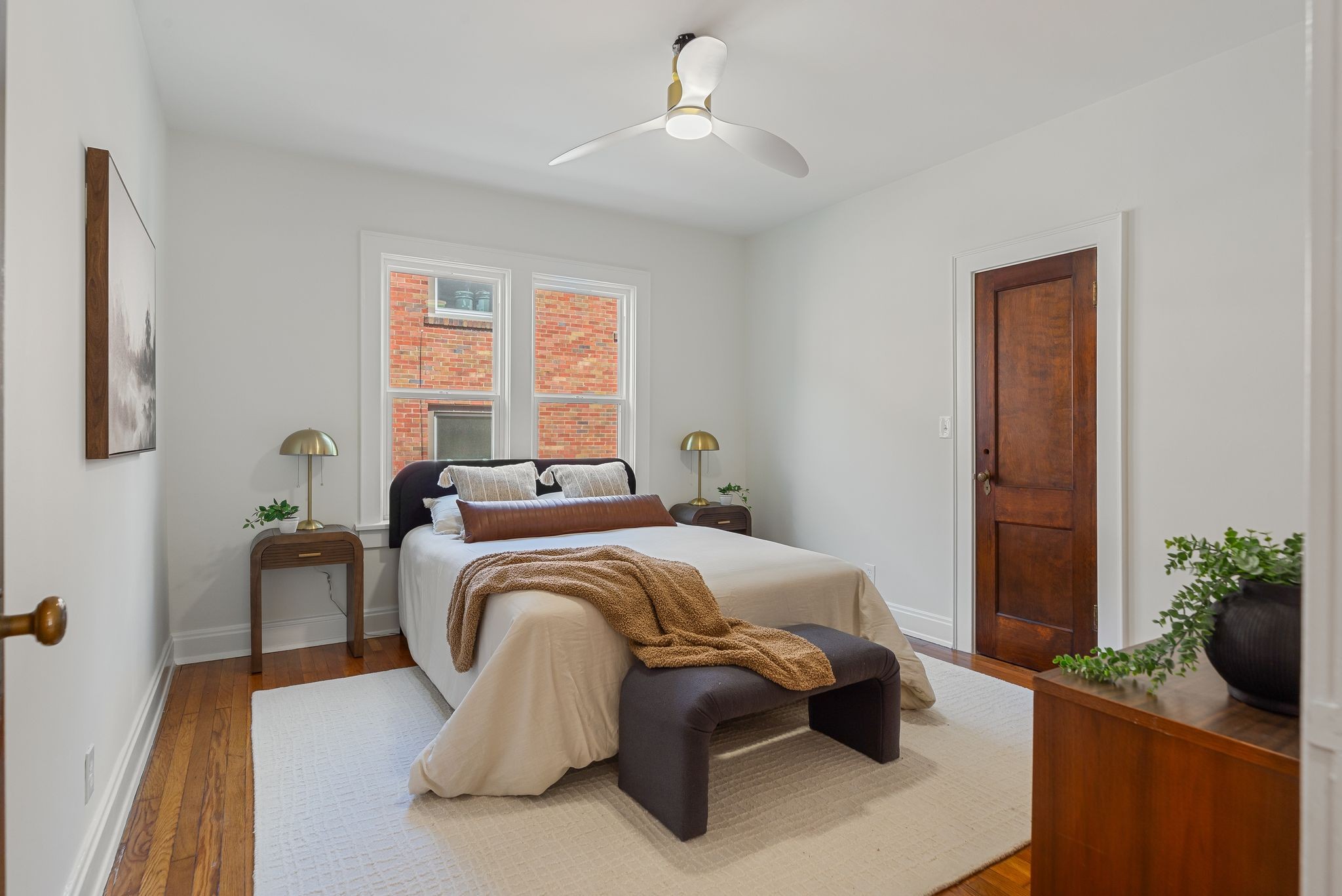 2005 Convent Place, Unit 1 Nashville, TN 37212 - Photo 35 of 41 a bed sitting in a bedroom next to a window