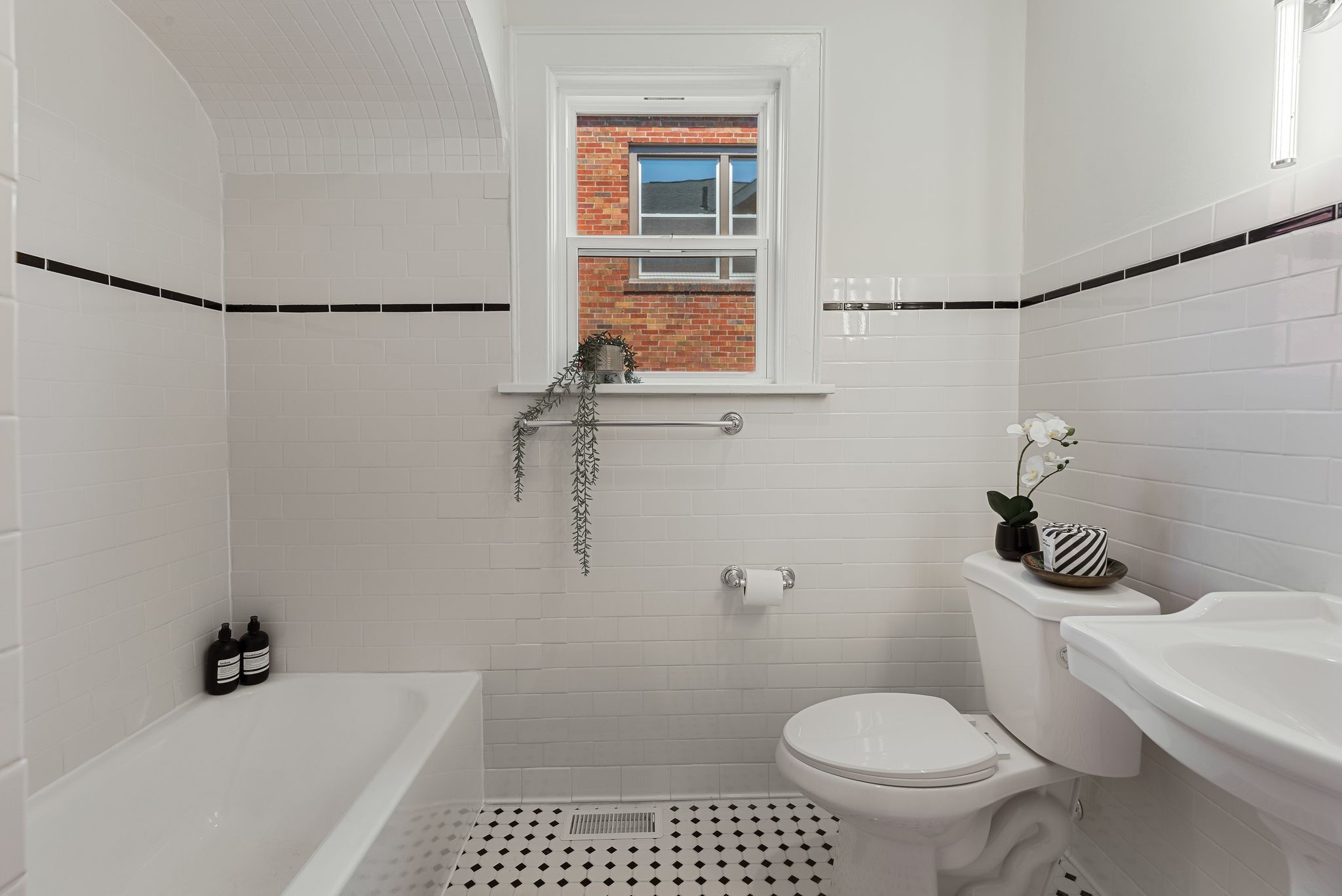 2005 Convent Place, Unit 1 Nashville, TN 37212 - Photo 38 of 41 a white toilet sitting next to a bath tub