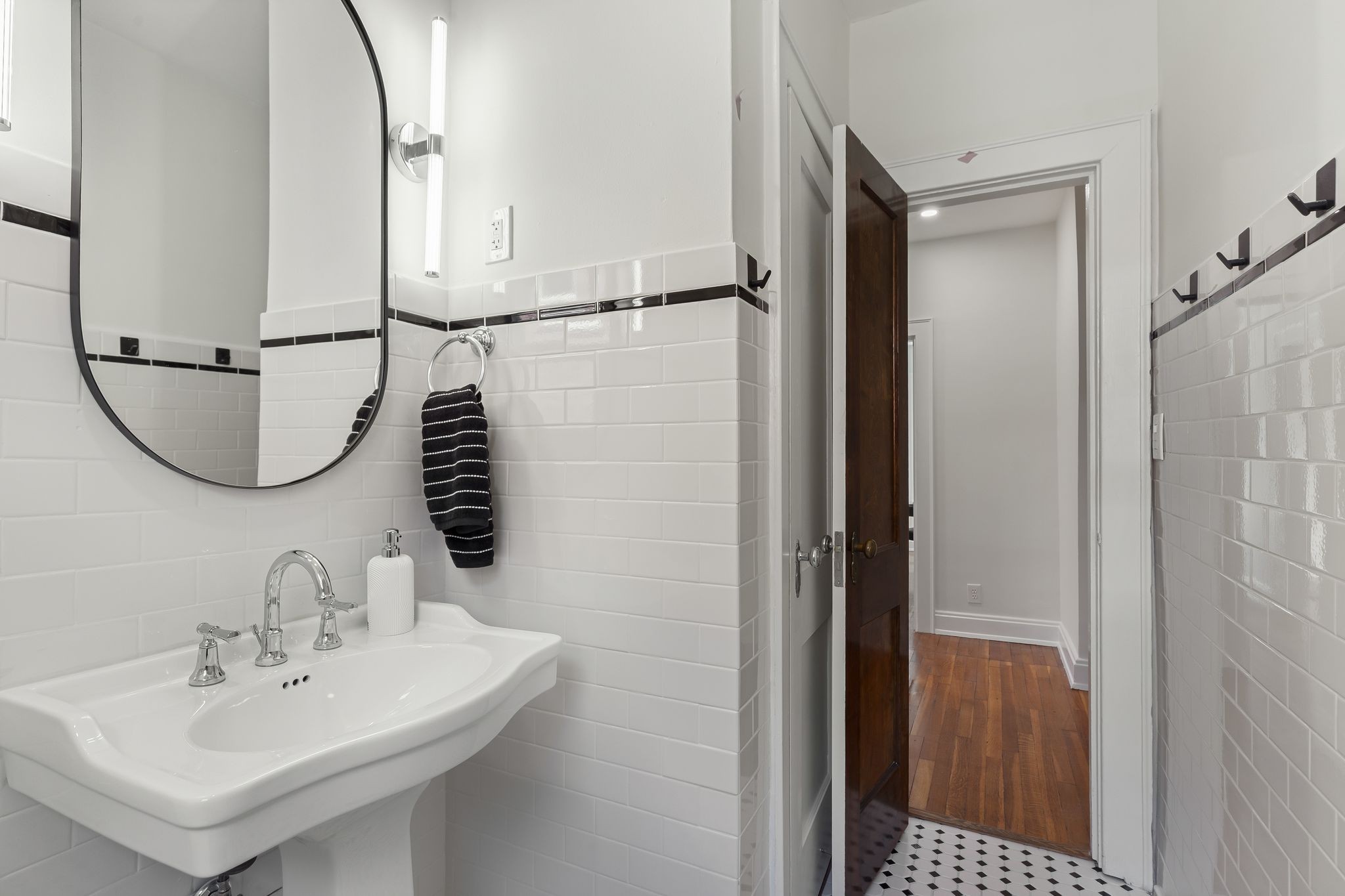 2005 Convent Place, Unit 1 Nashville, TN 37212 - Photo 39 of 41 a bathroom with a sink and a mirror