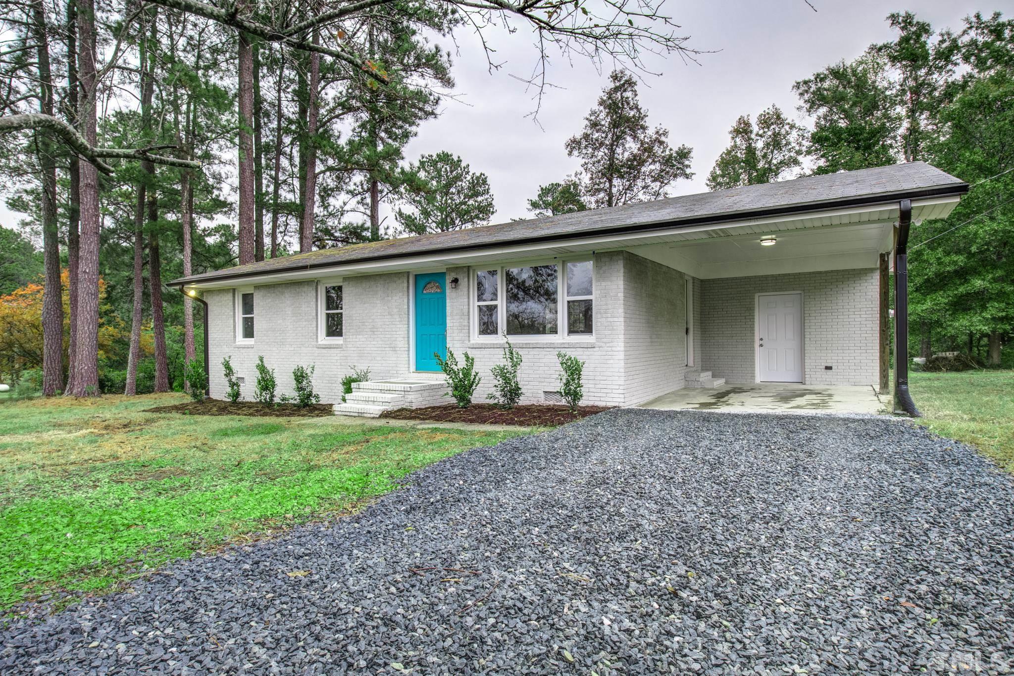 3600 Edgemont Road Wendell, NC 27591 - Photo 1 of 30 a front view of a house with garden