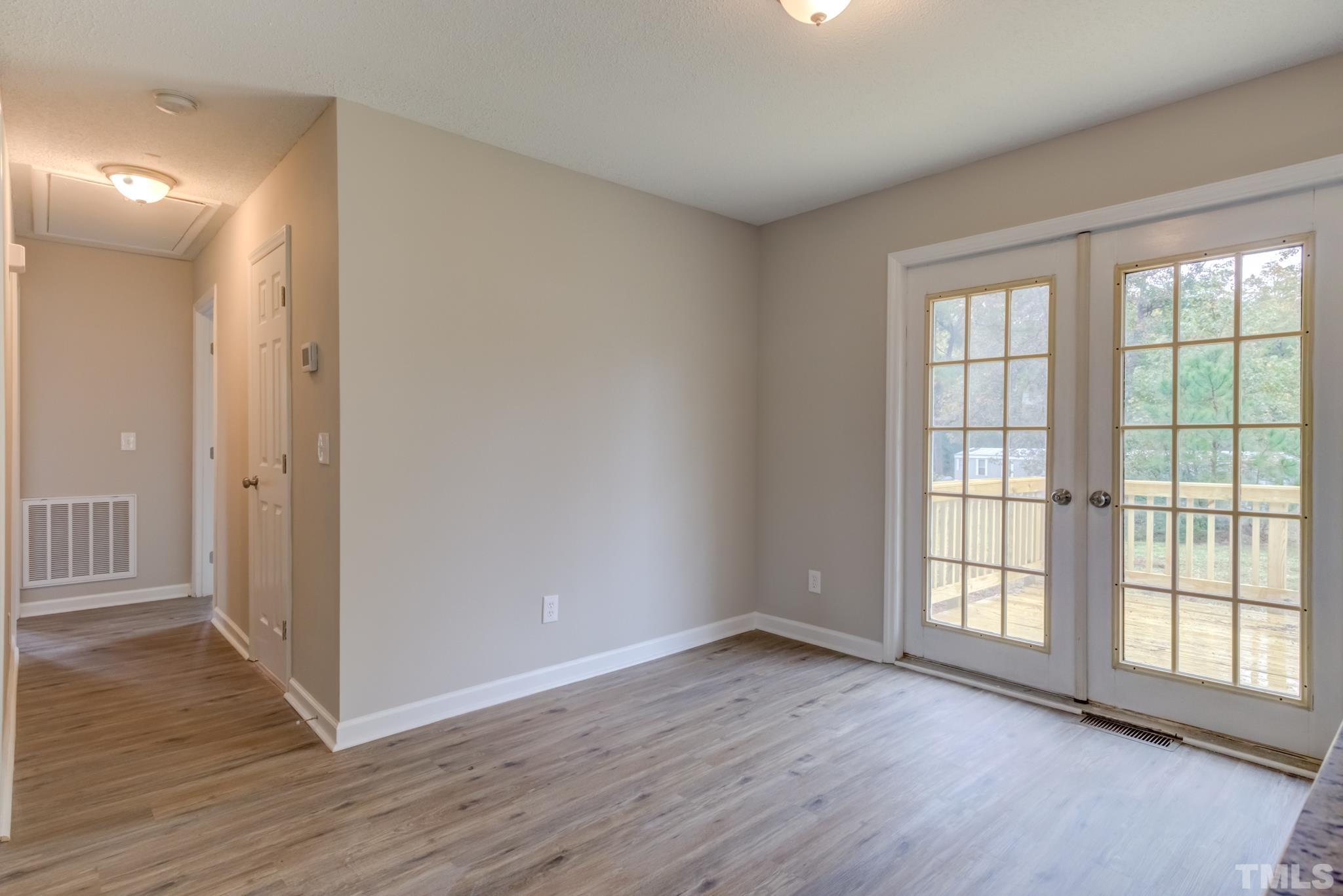 3600 Edgemont Road Wendell, NC 27591 - Photo 18 of 30 wooden floor in an empty room with a window